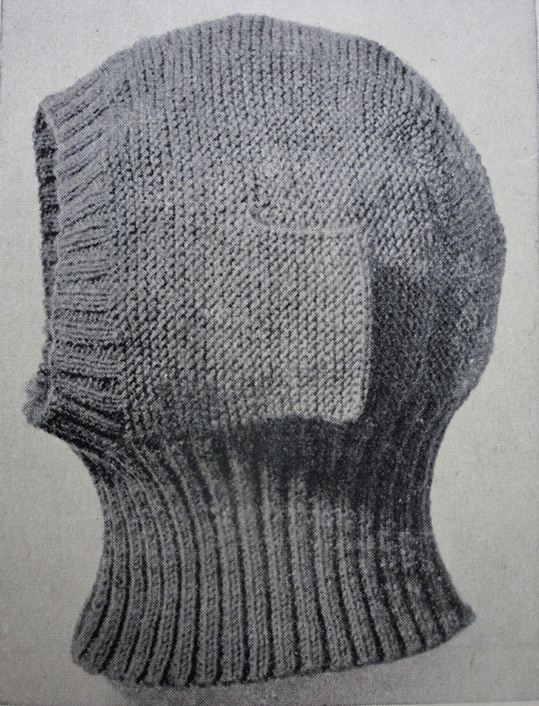 A knitted balaclava helmet with adjustable earflaps, worn during the Crimean War and reappropriated during world wars I and II, 1941. Public domain image
