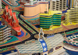 Bodys Isek Kingelez. Ville Fantôme (detail). 1996. Paper, paperboard, plastic, and other materials, 47 1/4 × 224 7/16 × 94 1/2″ (120 × 570 × 240 cm). CAAC – The Pigozzi Collection, Geneva. © Bodys Isek Kingelez. Photo: Maurice Aeschimann. Courtesy CAAC – The Pigozzi Collection