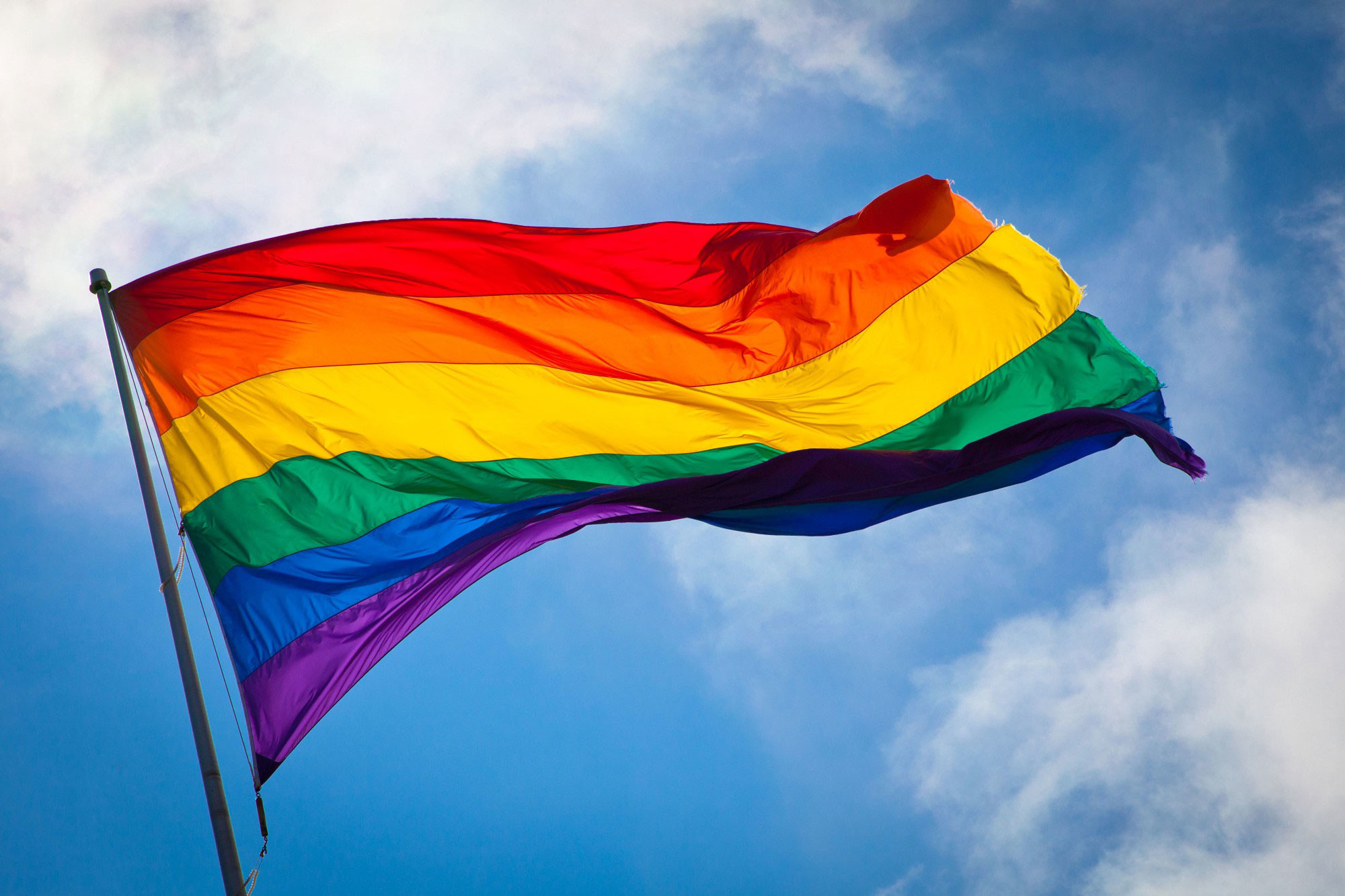 The Rainbow Flag waving in the wind at San Francisco’s Castro District. Photo: Benson Kua. Image used through Wikimedia Commons