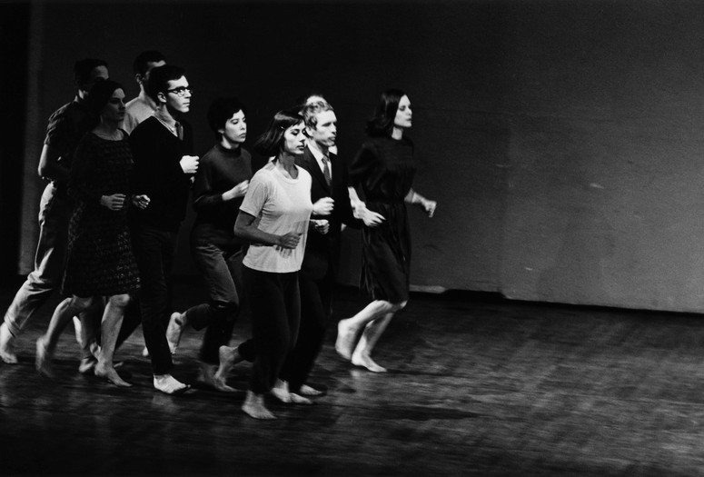Peter Moore’s photograph of Robert Rauschenberg, Joseph Schlichter (back), Sally Gross, Tony Holder, Deborah Hay, and Robert Morris (middle), Yvonne Rainer, Alex Hay, and Lucinda Childs (front) in We Shall Run, 1963. Performed in Two Evenings of Dances by Yvonne Rainer, Wadsworth Atheneum, Hartford, Connecticut, March 7, 1965. © Barbara Moore/Licensed by VAGA at ARS, NY. Courtesy Paula Cooper Gallery, New York
