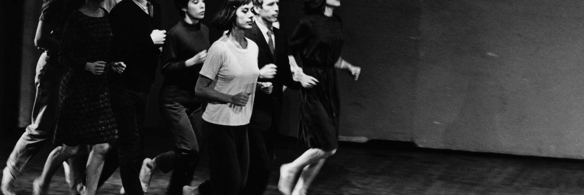 Peter Moore’s photograph of Robert Rauschenberg, Joseph Schlichter (back), Sally Gross, Tony Holder, Deborah Hay, and Robert Morris (middle), Yvonne Rainer, Alex Hay, and Lucinda Childs (front) in We Shall Run, 1963. Performed in Two Evenings of Dances by Yvonne Rainer, Wadsworth Atheneum, Hartford, Connecticut, March 7, 1965. © Barbara Moore/Licensed by VAGA at ARS, NY. Courtesy Paula Cooper Gallery, New York