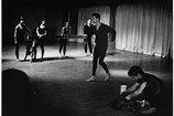 Peter Moore’s photograph of Terrain, 1963. Performed at Judson Memorial Church, April 28, 1963. Pictured, from left: William Davis and Albert Reid (foreground); Yvonne Rainer, Judith Dunn, Trisha Brown, and Steve Paxton (background). © Barbara Moore/Licensed by VAGA, New York, NY. Courtesy Paula Cooper Gallery, New York