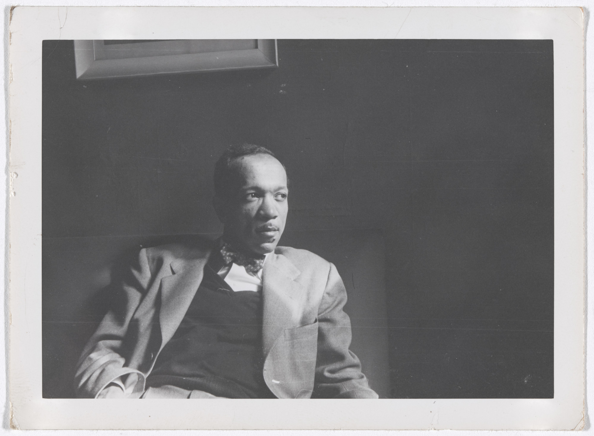 Unknown photographer. Charles White, c. 1950. Black-and-white photograph, 3 5/16 × 4 9/16" (8.4 × 11.6 cm). Private collection. © The Charles White Archives