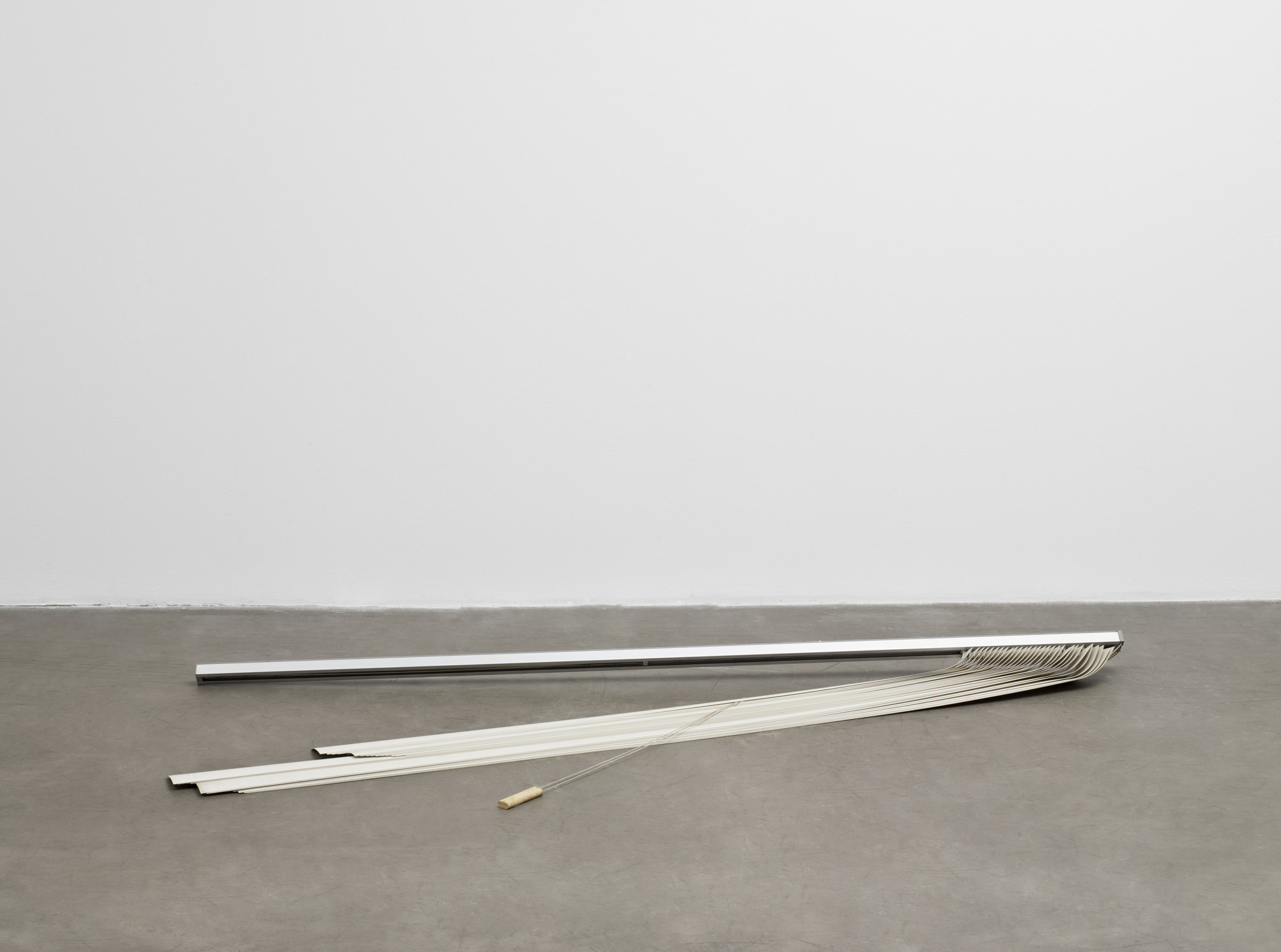 Gedi Sibony. _The Middle of the World._ 2008.
Vertical blinds, 36" x 7' 5 1/2" x 13" (91.4 x 227.3 x 33 cm).
The Museum of Modern Art, New York. Fund for the Twenty First Century.
© 2010 Gedi Sibony.