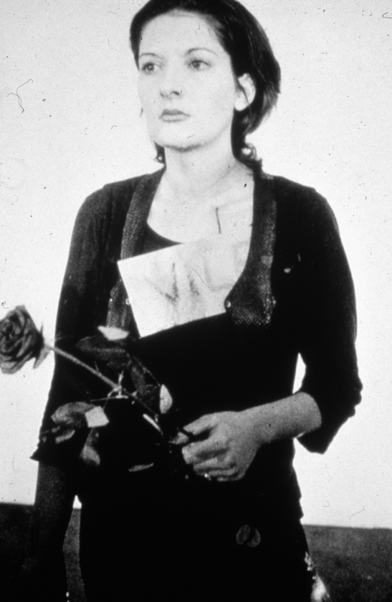 Marina Abramović. _Rhythm 0._ Performed in 1974 for 6 hours at Studio Morra, Naples
Still from 35mm slide projection (black and white and color, silent) with 72 objects. Duration variable © 2010 Marina Abramović. Courtesy the artist and Sean Kelly Gallery/Artists Rights Society (ARS), New York