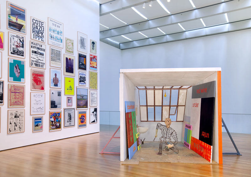 Installation view of Martin Kippenberger's _Spiderman Studio (Spiderman-Atelier),_1996, at The Museum of Modern Art.  
Wood, metal, plastic, Plexiglas, mirrors, bronze, Styrofoam, painted canvases, vodka bottle, and balsa, 110 1/4 x 120 1/16 x 154 3/4 in.  
The Herbert Foundation  
  
 © Estate Martin Kippenberger, Galerie Gisela Capitain, Cologne  
  
 Photo © 2009 Jason Mandella