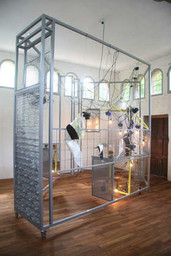 Haegue Yang (Korean, born 1971). Sallim. 2009. Steel frame, perforated metal plate, caster, aluminum venetian blinds, knitting yarn, acrylic mirror, IV stand, light bulbs, cable, electric fan, timer, garlic, dishes, hot pad, and scent emitter, overall 8' 2 1/2" x 13' 9 3/8" x 10' 2" (250 x 420 x 310 cm). Fund for the Twenty-First Century and gift of Agnes Gund, Glenn Fuhrman, and Jerry I. Speyer, 2010. © 2015 Haegue Yang