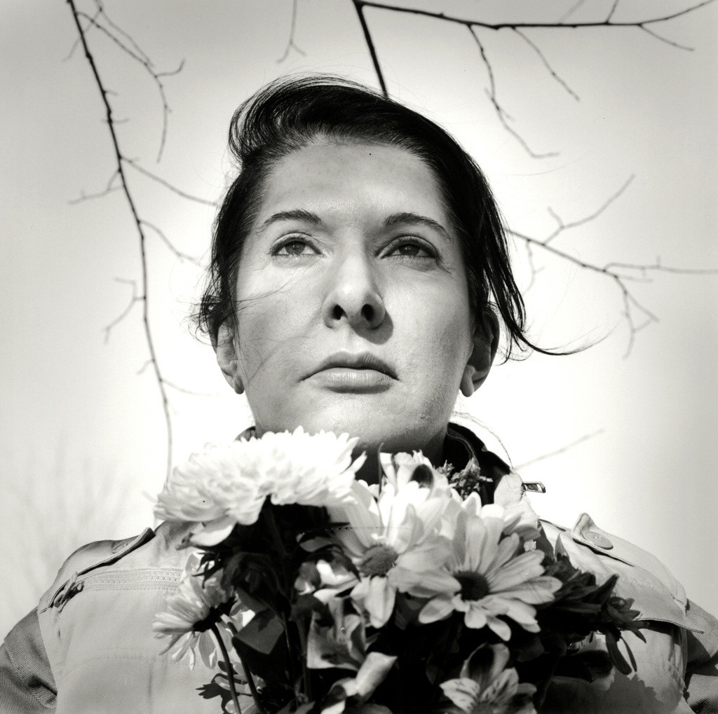 Marina Abramović. _Portrait with Flowers._ 2009. Black-and-white gelatin silver print; photo: Marco Anelli. © 2010 Marina Abramović. Courtesy the artist and Sean Kelly Gallery/Artists Rights Society (ARS), New York
