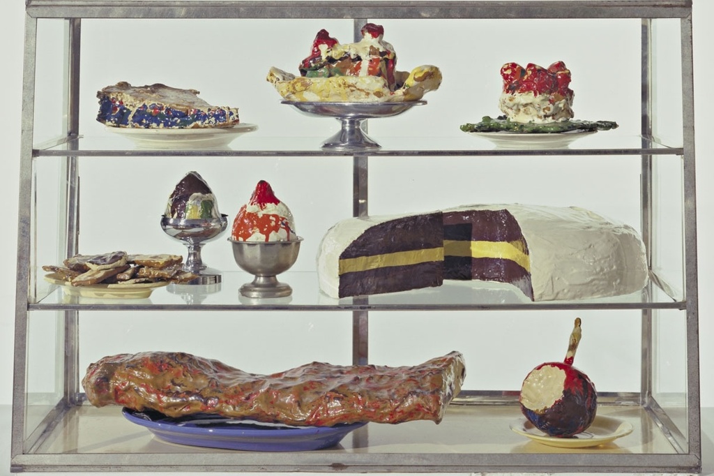 Pastry Case, I
Date: 1961-62
Medium: Burlap and muslin soaked in plaster, painted with enamel, metal bowls, and ceramic plates in glass-and-metal case
Dimensions: 20 3/4 x 30 1/8 x 14 3/4" (52.7 x 76.5 x 37.3 cm)
Credit Line: The Sidney and Harriet Janis Collection
MoMA Number: 639.1967.a-dd