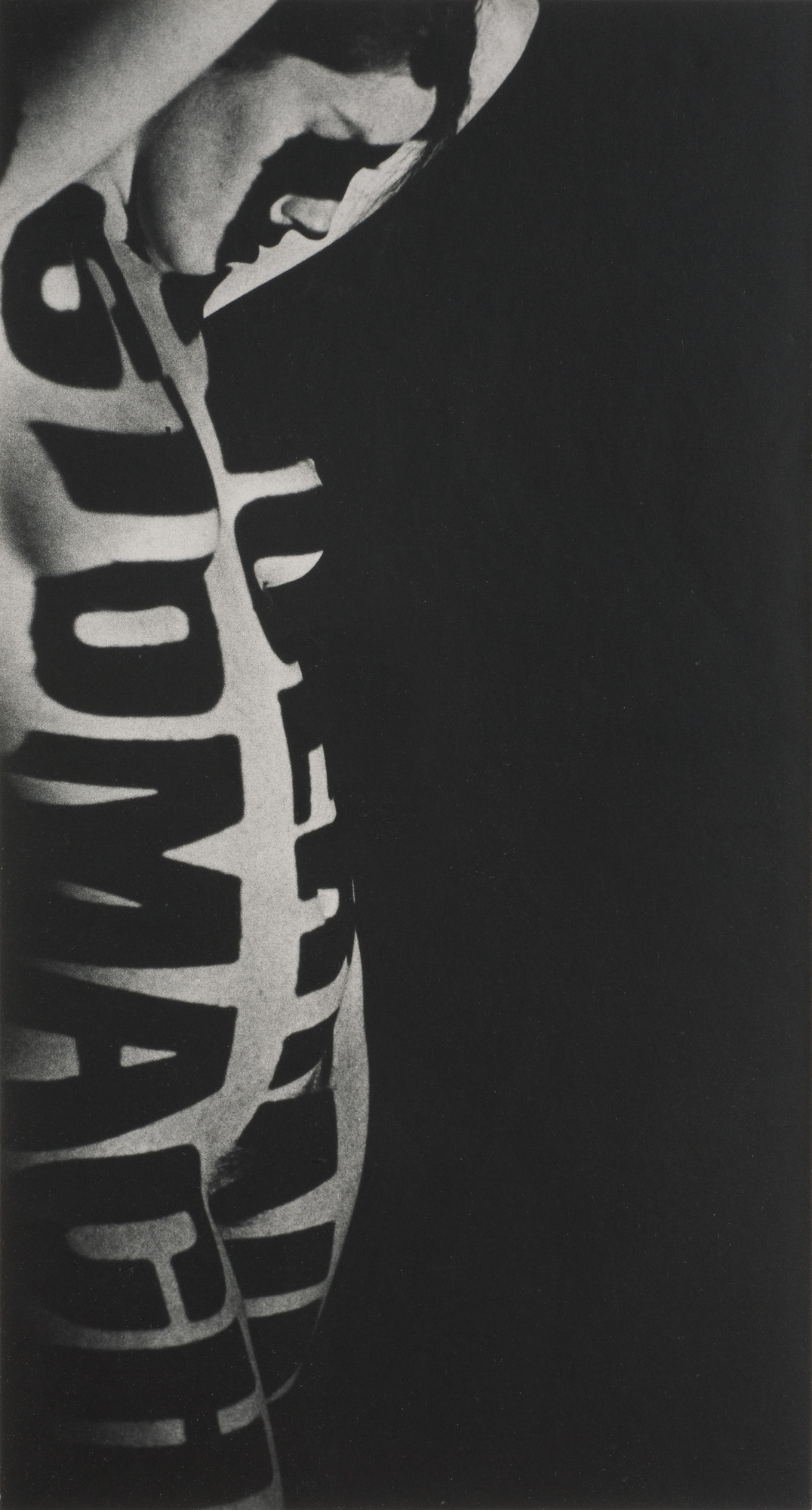 Robert Heinecken. _Typographic Nude_. 1965. Gelatin silver print, 14 ½ × 7″ (36.8 × 17.8 cm). Collection Geofrey and Laura Wyatt, Santa Barbara, California. © 2014 The Robert Heinecken Trust