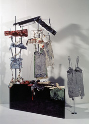 Lingerie Counter
Date: 1962
Medium: Textiles, canvas, plaster, enamel, metal stand, neon tube, mirror, and fiberboard
Dimensions: 7' 1 13/16" x 63 3/4" x 50" (218 x 162 x 127 cm)
Credit Line: Ludwig Museum - Museum of Contemporary Art, Budapest