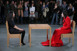 Installation view of Marina Abramović’s performance The Artist Is Present at The Museum of Modern Art, 2010. Photo by Scott Rudd. For her longest solo piece to date, Abramović will sit in silence at a table in the Museum’s Donald B. and Catherine C. Marron Atrium during public hours, passively inviting visitors to take the seat across from her for as long as they choose within the timeframe of the Museum’s hours of operation. Although she will not respond, participation by Museum visitors completes the piece and allows them to have a personal experience with the artist and the artwork. © 2010 Marina Abramović. Courtesy the artist and Sean Kelly Gallery/Artists Rights Society (ARS), New York