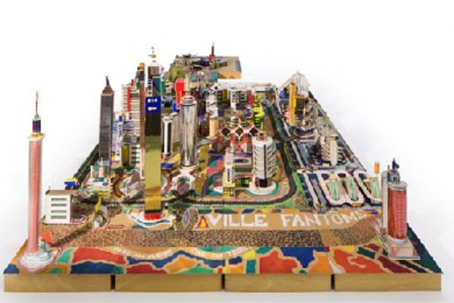 Bodys Isek Kingelez. Ville Fantôme. 1996. Paper, paperboard, plastic, and other materials, 47 1/4 × 224 7/16 × 94 1/2″ (120 × 570 × 240 cm). CAAC – The Pigozzi Collection, Geneva. © Bodys Isek Kingelez. Photo: Maurice Aeschimann. Courtesy CAAC – The Pigozzi Collection