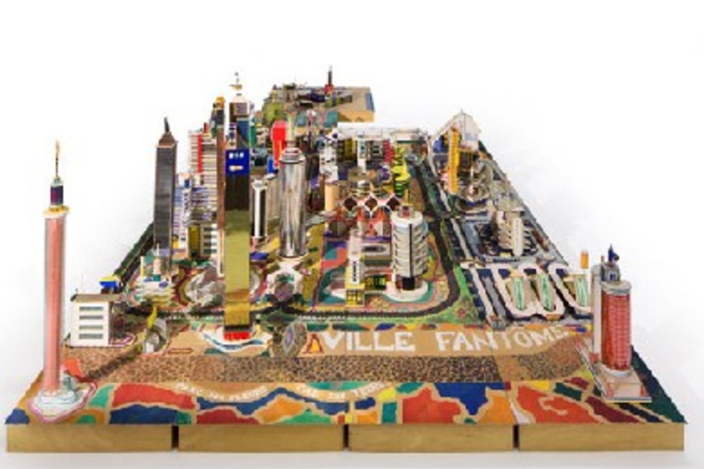 Bodys Isek Kingelez. Ville Fantôme. 1996. Paper, paperboard, plastic, and other materials, 47 1/4 × 224 7/16 × 94 1/2″ (120 × 570 × 240 cm). CAAC – The Pigozzi Collection, Geneva. © Bodys Isek Kingelez. Photo: Maurice Aeschimann. Courtesy CAAC – The Pigozzi Collection