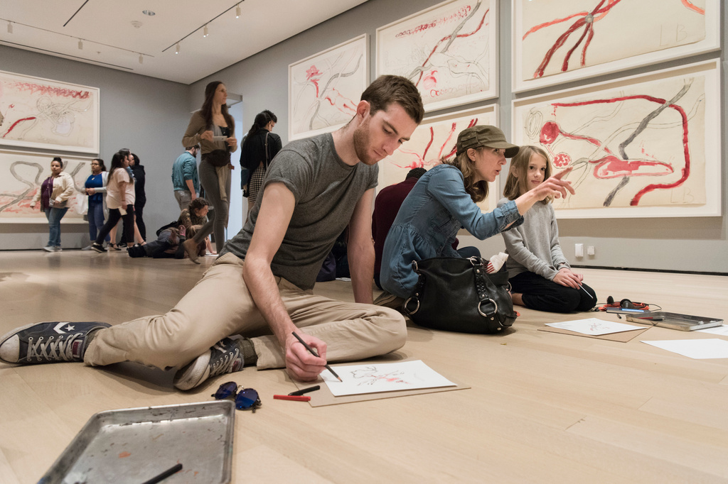 Visitors participating in activities in Louise Bourgeois: An Unfolding Portrait. The Museum of Modern Art, New York, September 24, 2017–January 28, 2018. © The Easton Foundation/VAGA at ARS, NY. Photo: Martin Seck