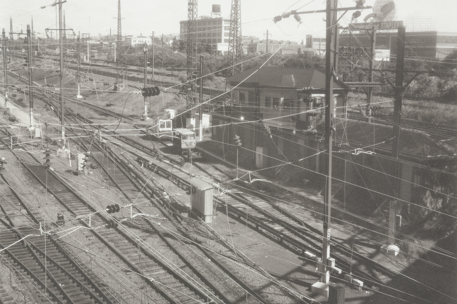 Madoka Takagi. Long Island Railroad Yard from Queens Boulevard, Queens.1990. Platinum/Palladium print, 7 1/2 x 9 1/2" (19.1 x 24.2 cm). Gift of Jessica and Robert Solomon. © 2019 Madoka Takagi