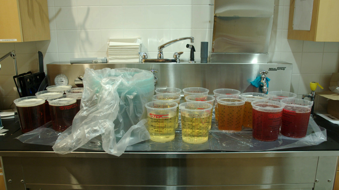 The containers in this image hold all of the carbonated liquid ingredients—including microbrewed beer and kombucha for “Williamsburg” and champagne for “Bottle Service”—for blending into the drinks.