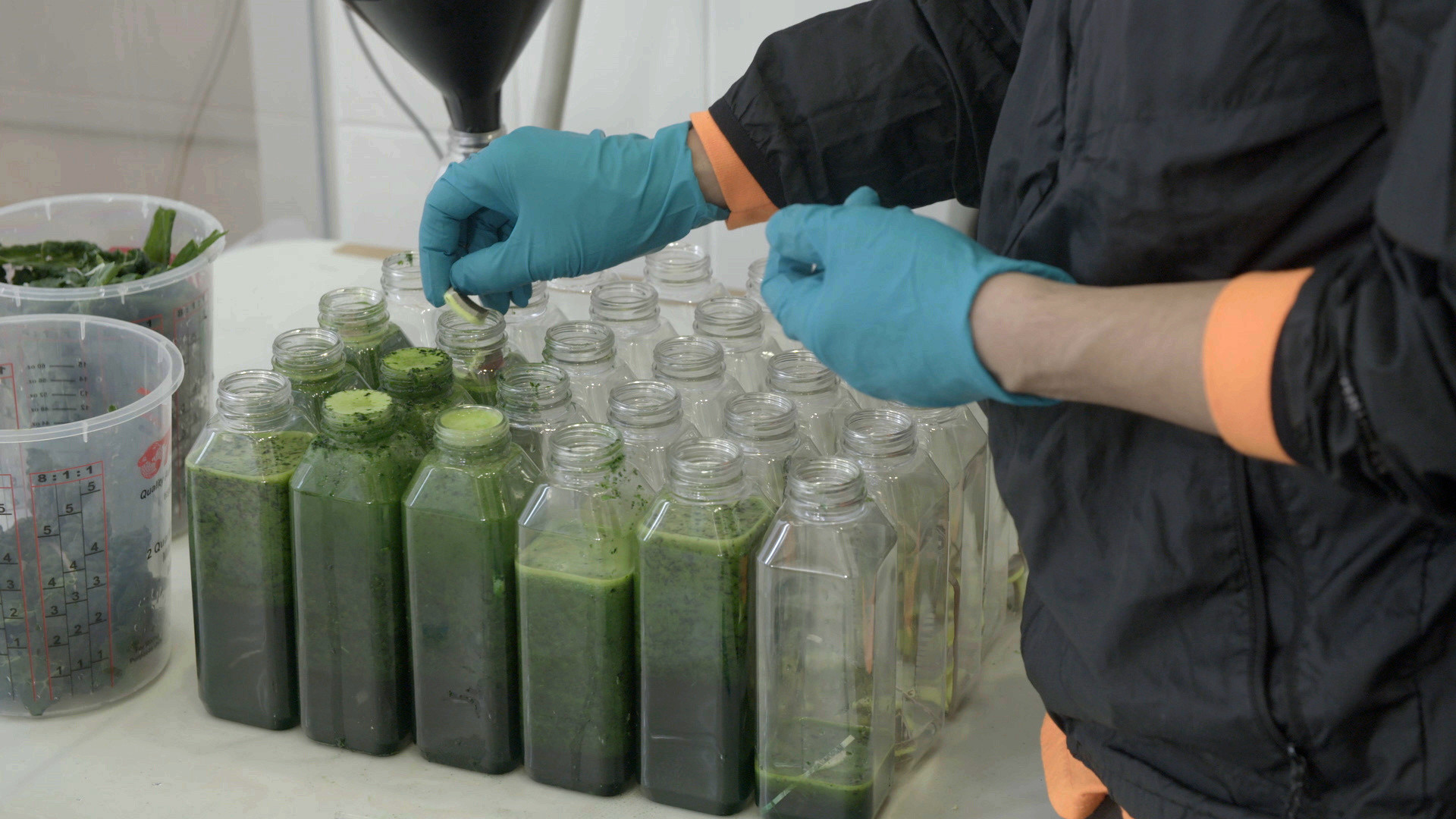 Some ingredients were not blended and were simply added at the very end. Here, the artist places pieces of the cut-up tennis balls.