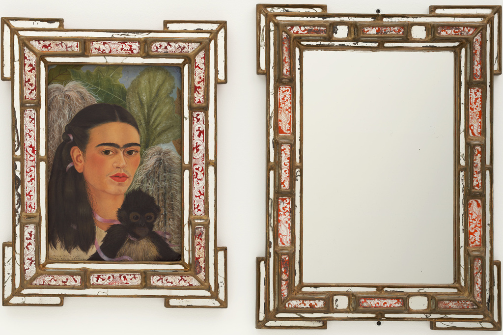 Frida Kahlo. Fulang-Chang and I. 1937 (assembled after 1939). In two parts, oil on composition board (1937) with painted mirror frame (added after 1939); and mirror with painted mirror frame (after 1939), framed painting, left 22 1/4 x 17 3/8 x 1 3/4" (56.5 x 44.1 x 4.4 cm); framed mirror, right 25 1/4 x 19 x 1 3/4" (64.1 x 48.3 x 4.4 cm). Mary Sklar Bequest. © 2019 Banco de México Diego Rivera Frida Kahlo Museums Trust, Mexico, D.F. / Artists Rights Society (ARS), New York
