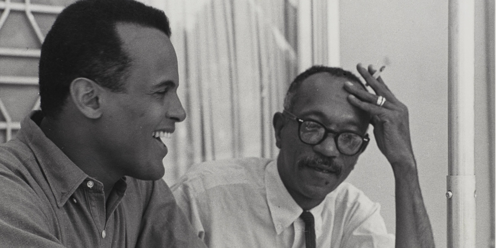 Charles White and Harry Belafonte working on Songs Belafonte Sings. c. 1960. Black-and-white photograph. © The Charles White Archives