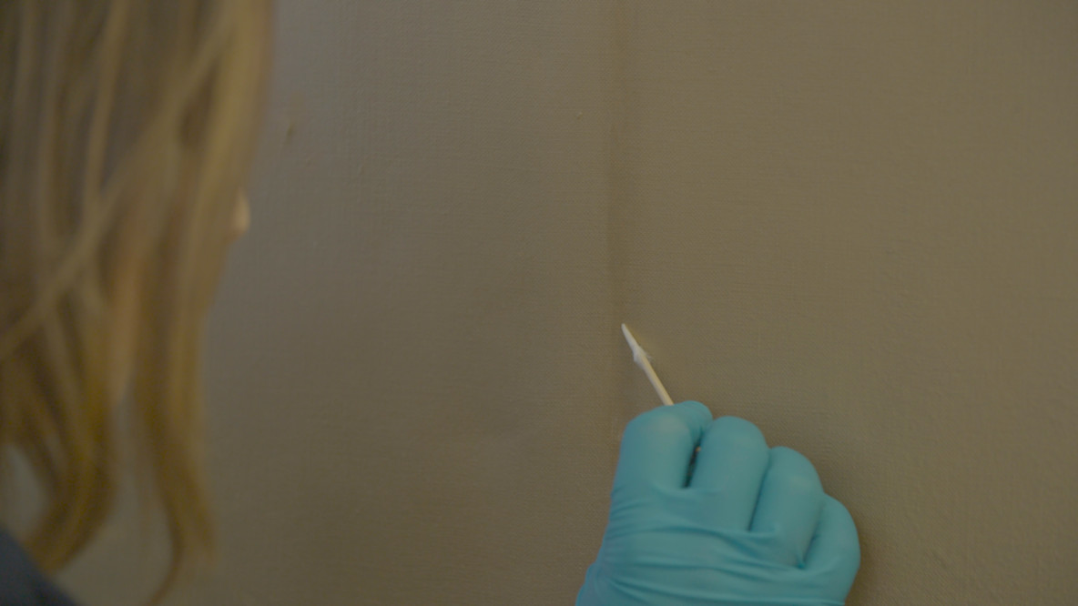 Emily Mulvihill repairs a dark mark on Gold Marilyn Monroe.
