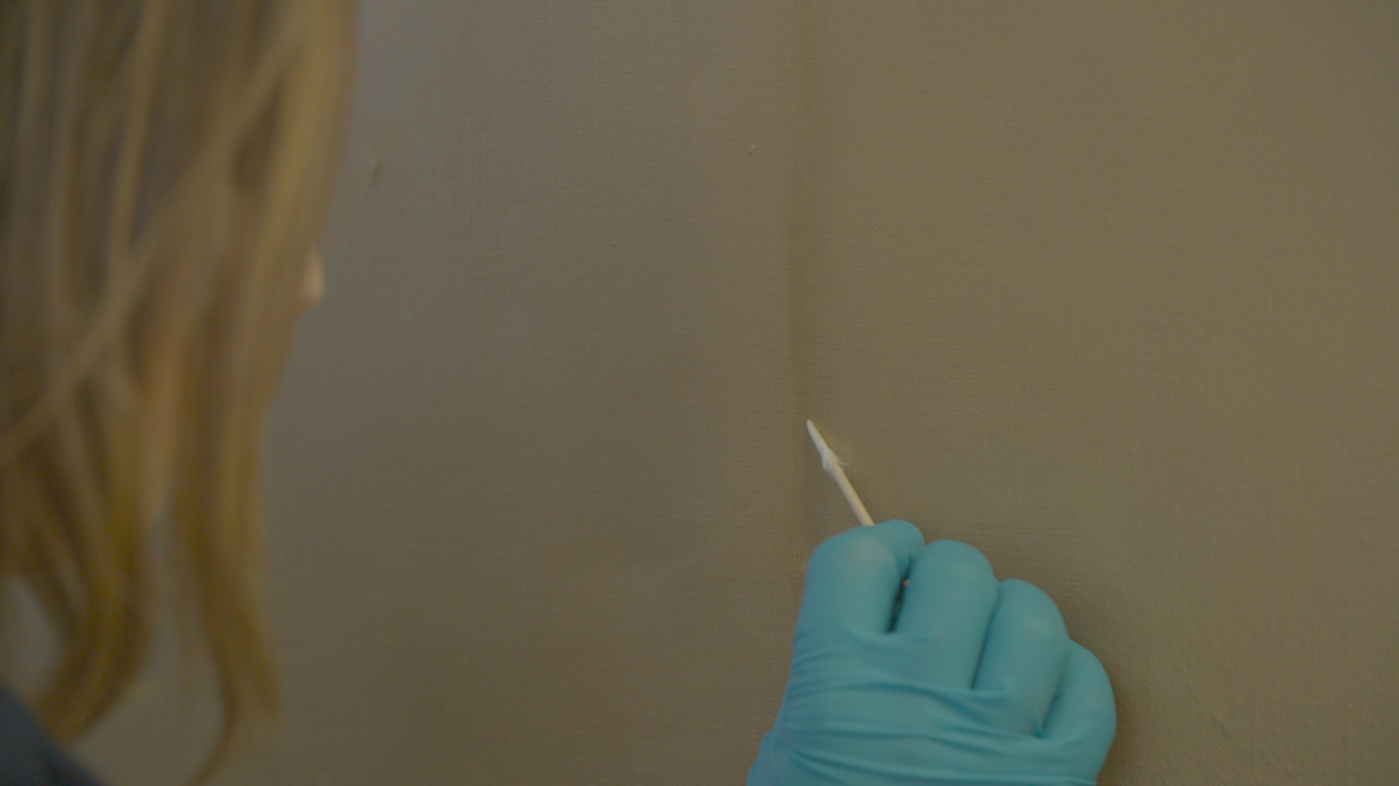 Emily Mulvihill repairs a dark mark on Gold Marilyn Monroe.