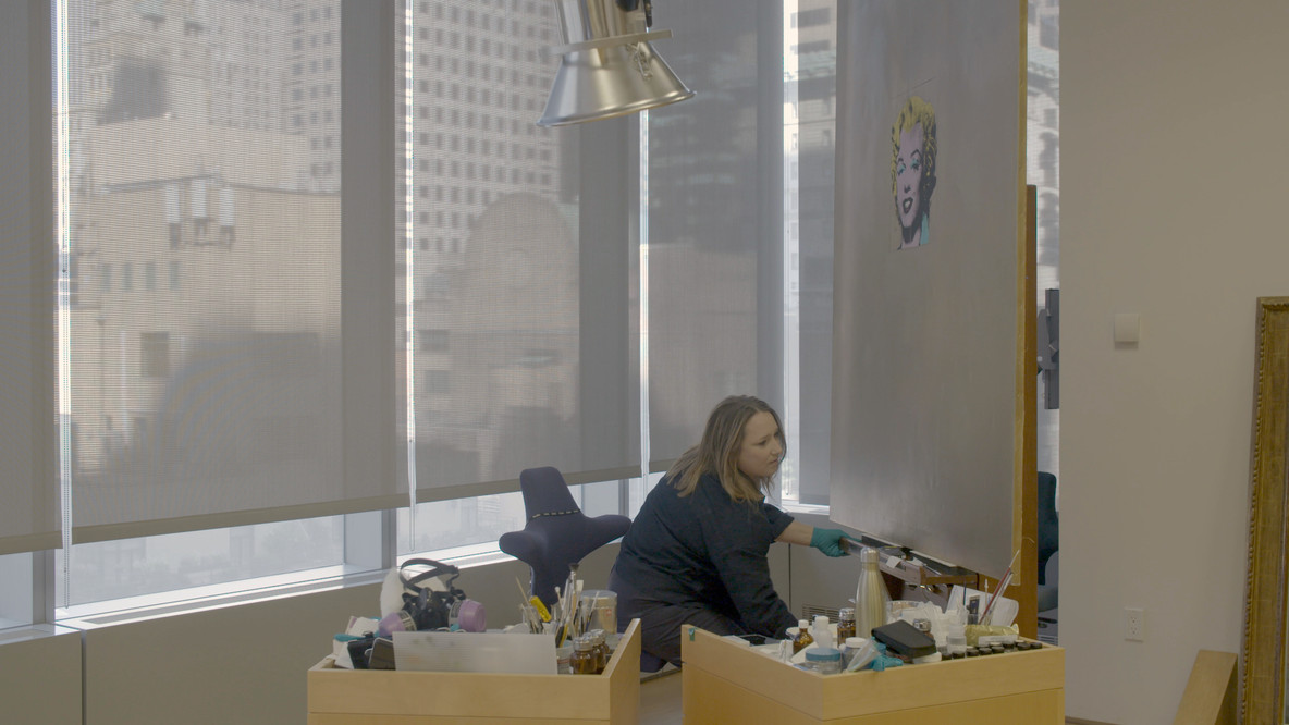 Emily Mulvihill prepares to work on Gold Marilyn Monroe.