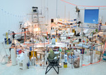 Sarah Sze. Triple Point (Pendulum). 2013. Salt, water, stone, string, projector, video, pendulum, and other materials, dimensions variable, approximately 150 × 210 × 200&#34; (381 × 533.4 × 508 cm). Gift of the International Council of The Museum of Modern Art, Agnes Gund, Ronald S. and Jo Carole Lauder, and Sharon Percy Rockefeller, in honor of the 60th Anniversary of the International Council