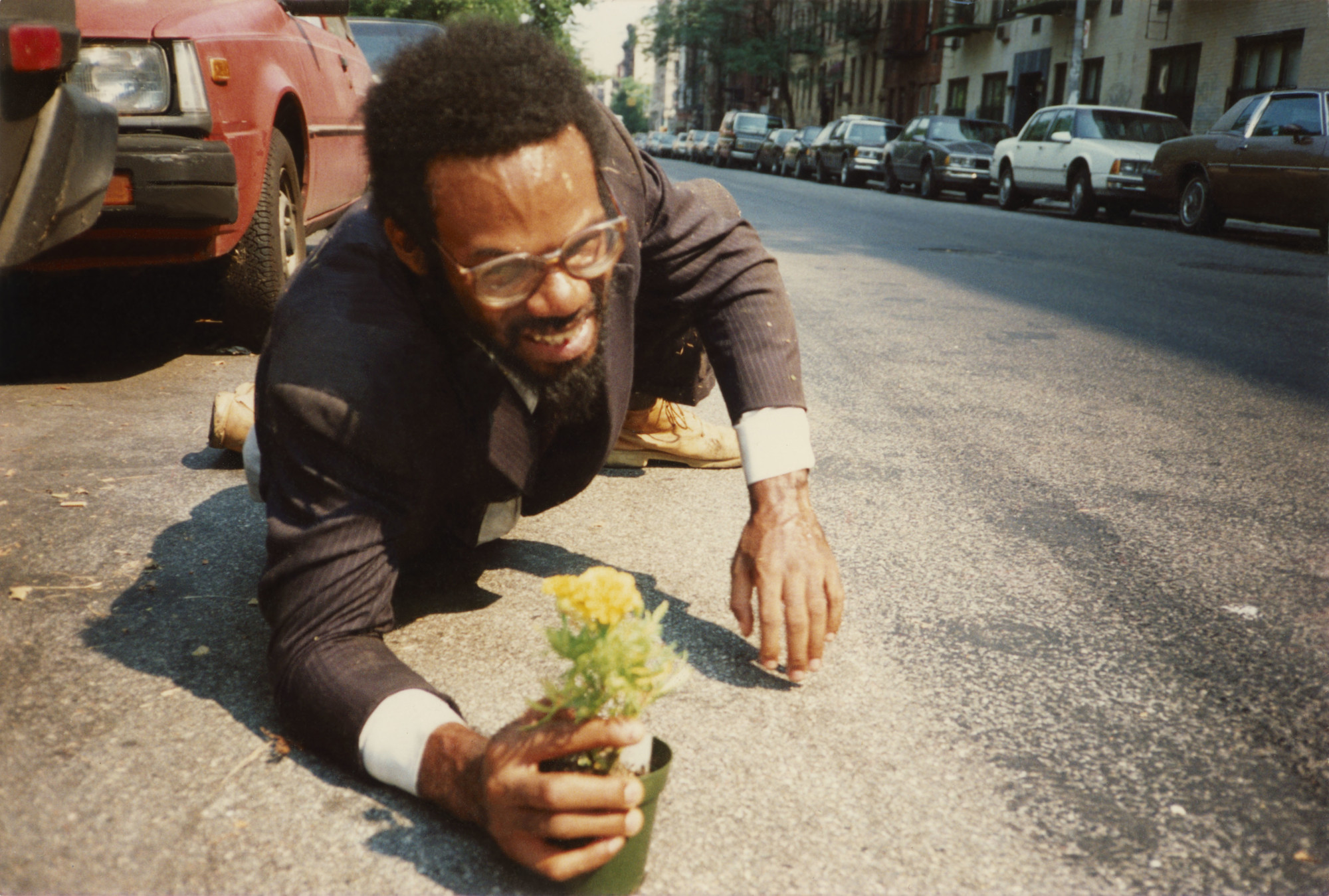 Pope.L (American, born 1955). _How Much Is That Nigger in the Window a.k.a. Tompkins Square Crawl, Tompkins Square Park, New York_. 1991. Inkjet print, 10 × 15" (25.4 × 38.1 cm). The Museum of Modern Art, New York. Acquired in part through the generosity of Jill and Peter Kraus, Anne and Joel S. Ehrenkranz, The Contemporary Arts Council of The Museum of Modern Art, The Jill and Peter Kraus Media and Performance Acquisition Fund, and Jill and Peter Kraus in honor of Michael Lynne. © Pope.L, courtesy the artist