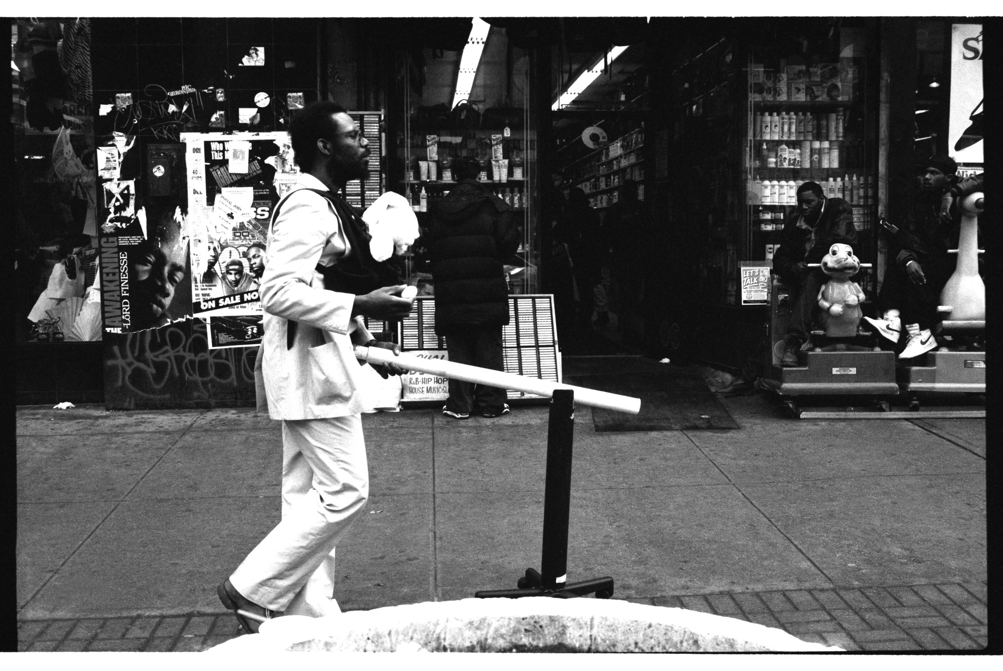 Pope.L (American, born 1955). _Member a.k.a. Schlong Journey, 125th Street, New York_. 1996. Inkjet print, 10 × 15" (25.4 × 38.1 cm). The Museum of Modern Art, New York. Acquired in part through the generosity of Jill and Peter Kraus, Anne and Joel S. Ehrenkranz, The Contemporary Arts Council of The Museum of Modern Art, The Jill and Peter Kraus Media and Performance Acquisition Fund, and Jill and Peter Kraus in honor of Michael Lynne. © Pope.L, courtesy the artist

