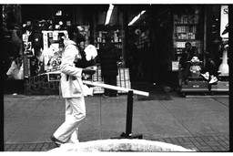 Pope.L (American, born 1955). Member a.k.a. Schlong Journey, 125th Street, New York. 1996. Inkjet print, 10 × 15" (25.4 × 38.1 cm). The Museum of Modern Art, New York. Acquired in part through the generosity of Jill and Peter Kraus, Anne and Joel S. Ehrenkranz, The Contemporary Arts Council of The Museum of Modern Art, The Jill and Peter Kraus Media and Performance Acquisition Fund, and Jill and Peter Kraus in honor of Michael Lynne. © Pope.L, courtesy the artist
