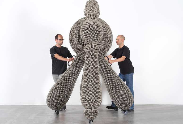 Haegue Yang. Sonic Handles – Law of Three Bodies from the installation Handles. 2019. Powder-coated steel frame, mesh, and handles, casters, nickel-plated bells, and metal rings, 240 × 190 × 265 cm. Commissioned for the Marron Atrium by The Museum of Modern Art, New York. © Haegue Yang. Photo: Nick Ash