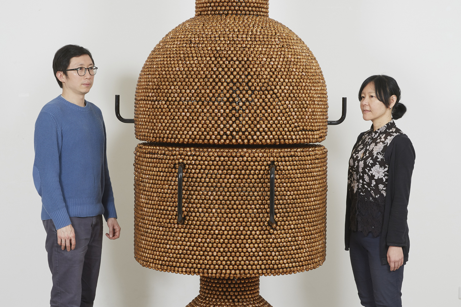 Haegue Yang. Sonic Coupe Copper – Enclosed Unity from the installation Handles. 2019. Powder-coated steel frame, mesh, and handles, casters, nickel-plated bells, and metal rings, 240 × 190 × 265 cm. Commissioned for the Marron Atrium by The Museum of Modern Art, New York. © Haegue Yang.