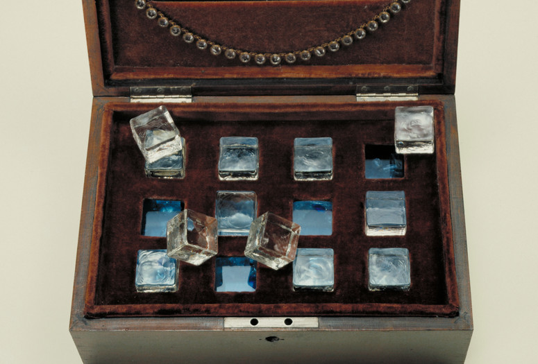 Joseph Cornell. Taglioni's Jewel Casket.1940. Velvet-lined wooden box containing glass necklace, jewelry fragments, glass chips, and glass cubes resting in slots on glass, 4 3/4 x 11 7/8 x 8 1/4" (12 x 30.2 x 21 cm). Gift of James Thrall Soby