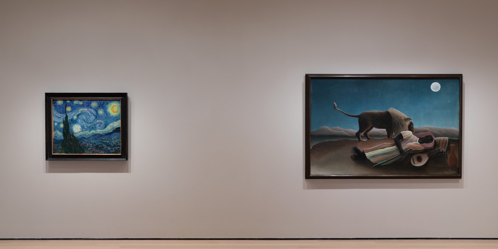 Installation view of the fifth-floor collection galleries, 2019. Shown, from left: Vincent van Gogh. The Starry Night. 1889. Oil on canvas. 29 × 36 1/4" (73.7 × 92.1 cm). Acquired through the Lillie P. Bliss Bequest (by exchange). Conservation was made possible by the Bank of America Art Conservation Project; Henri Rousseau. The Sleeping Gypsy. 1897. Oil on canvas, 51" × 6' 7" (129.5 × 200.7 cm). Gift of Mrs. Simon Guggenheim