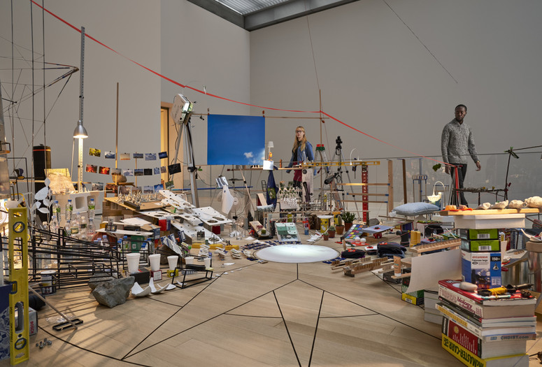 Sarah Sze. Triple Point (Pendulum). 2013. Salt, water, stone, string, projector, video, pendulum, and other materials, dimensions variable, approximately 150 × 210 × 200" (381 × 533.4 × 508 cm). Gift of the International Council of The Museum of Modern Art, Agnes Gund, Ronald S. and Jo Carole Lauder, and Sharon Percy Rockefeller, in honor of the 60th Anniversary of the International Council. Photo: Noah Kalina