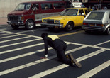 Pope. L. Times Square Crawl a.k.a Meditation Square Pieces. 1978. New York. Digital c-print on gold fiber silk paper. 10 x 15 in. 25.4 x 38.1 cm. © Pope.L. Courtesy of the artist and Mitchell – Innes &amp; Nash, New York