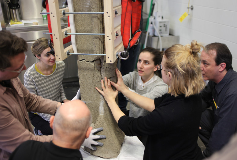 MoMA object conservators treating a Frank Lloyd Wright sculpture. Shown: Frank Lloyd Wright. Sprite from Midway Gardens, Chicago, IL. 1913–14. Cast concrete, 58 × 15 1/2 × 15" (147.3 × 39.4 × 38.1 cm). The Frank Lloyd Wright Foundation Archives (The Museum of Modern Art | Avery Architectural & Fine Arts Library, Columbia University, New York). © 2020 Frank Lloyd Wright Foundation/Artists Rights Society (ARS), New York. Pictured: Joe Militello, Trey Mosely, Jessica Betz, Ellen Moody, John Wood, and Megan Randall. Photo: Joy Bloser