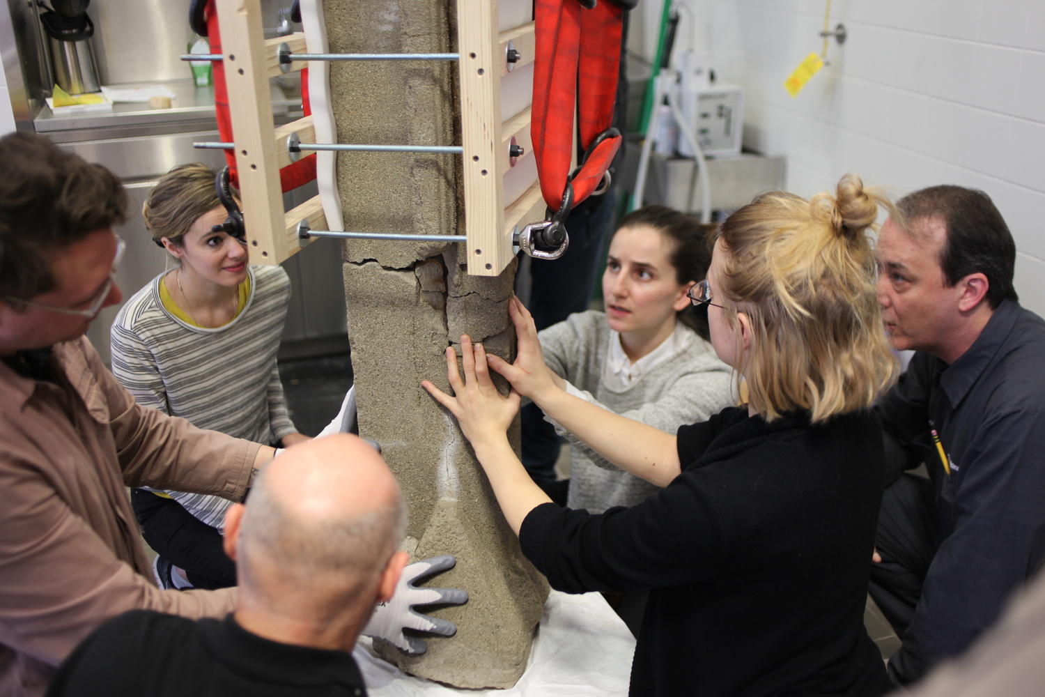 MoMA object conservators treating a Frank Lloyd Wright sculpture. Shown: Frank Lloyd Wright. Sprite from Midway Gardens, Chicago, IL. 1913–14. Cast concrete, 58 × 15 1/2 × 15" (147.3 × 39.4 × 38.1 cm). The Frank Lloyd Wright Foundation Archives (The Museum of Modern Art | Avery Architectural & Fine Arts Library, Columbia University, New York). © 2020 Frank Lloyd Wright Foundation/Artists Rights Society (ARS), New York. Pictured: Joe Militello, Trey Mosely, Jessica Betz, Ellen Moody, John Wood, and Megan Randall. Photo: Joy Bloser