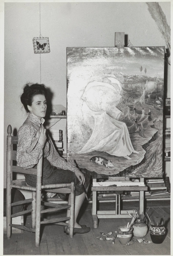 Leonora Carrington with her painting The Temptation of Saint Anthony