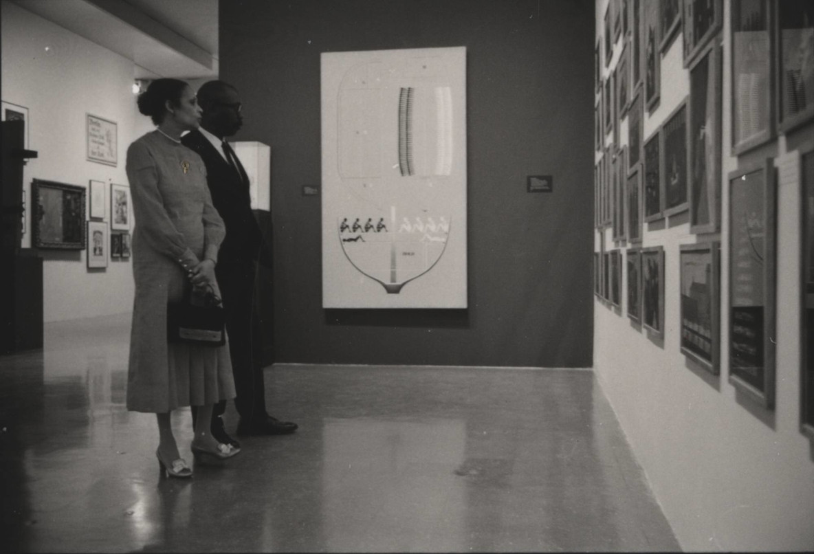 Jacob Lawrence and Gwen Knight at a reception for the MoMA exhibition The Artist as Adversary, 1971