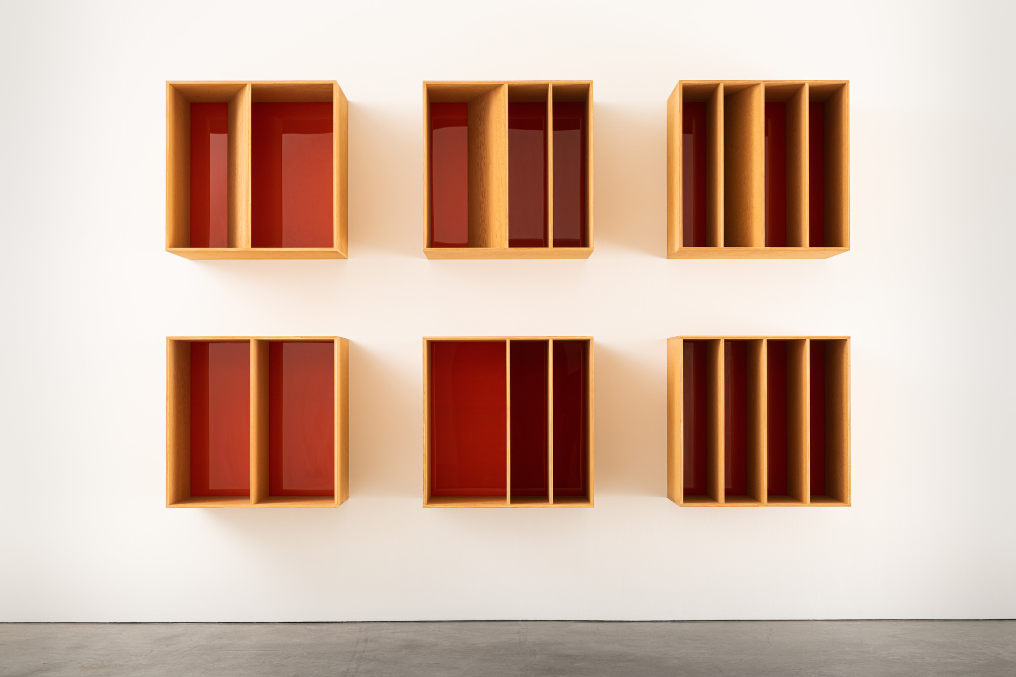 Donald Judd. _Untitled_. 1986. Douglas Fir plywood and orange Plexiglas. 6 units, each: 39 3/8 × 39 3/8 × 19 11/16" (100 × 100 × 50 cm) with 19 11/16"(50 cm) intervals. Overall: 98 1/2 x 157 5/8 x 29 1/2" (250.2 x 400.4 x 74.9). Marieluise Hessel Collection, Hessel Museum of Art, Center for Curatorial Studies, Bard College, Annandale-on-Hudson, New York. © 2020 Judd Foundation / Artists Rights Society (ARS), New York