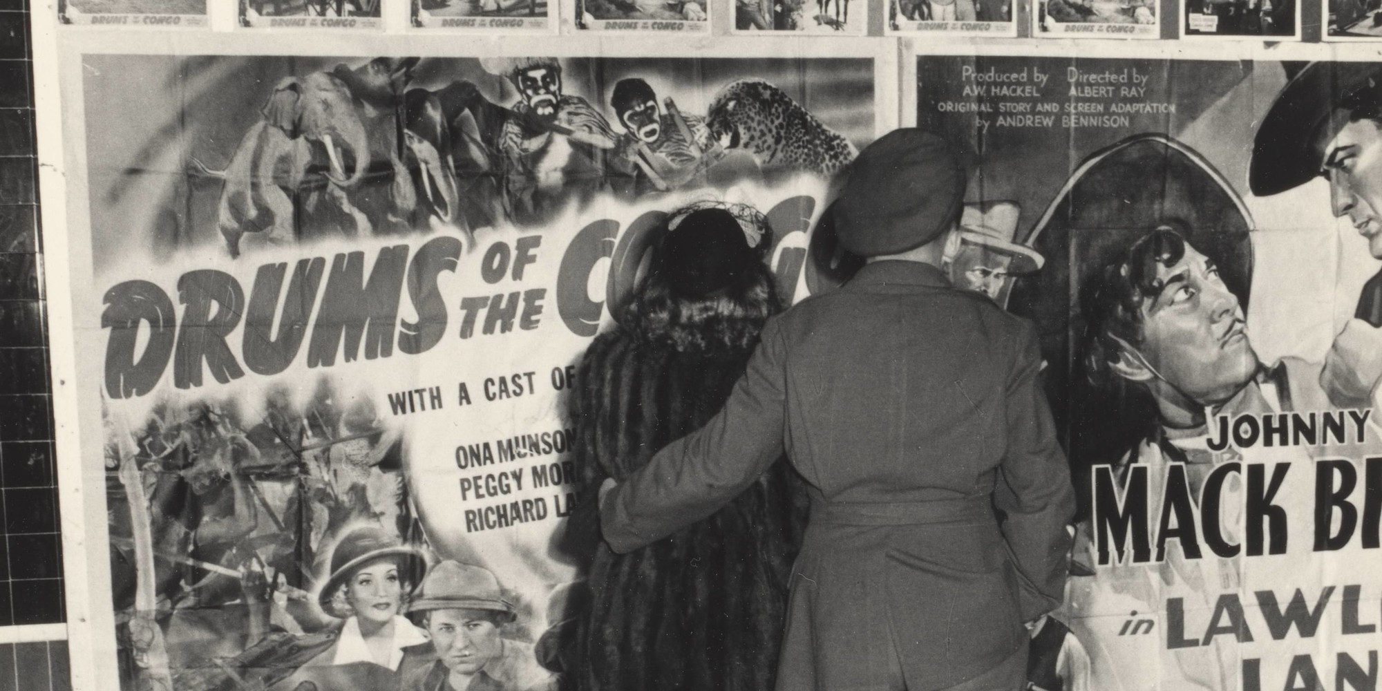 Dorothea Lange Oakland, California (couple, movie posters). 1942. Gelatin silver print, printed 1965. Purchase