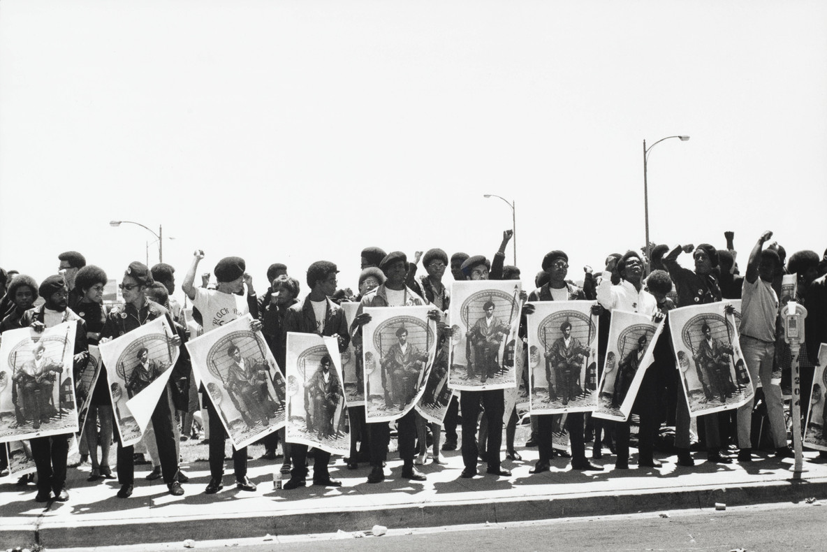 Stephen Shames. Black Panthers hold Free Huey signs at a rally at the Alameda County Courthouse where Black Panther Minister of Defense, Huey P. Newton, is on trial for killing an Oakland policeman, Oakland, California. September 1968