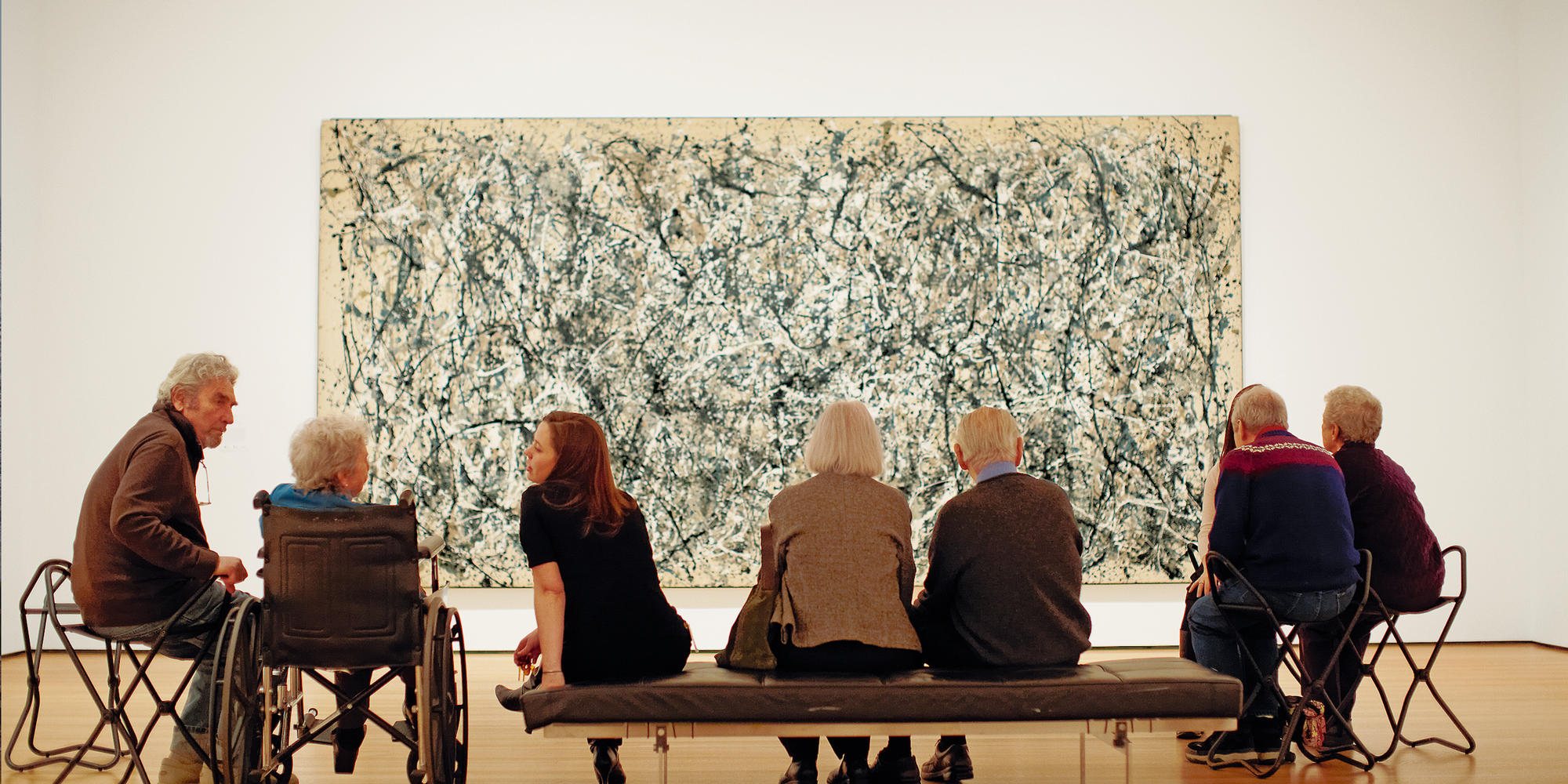 Visitors in the galleries. Shown: Jackson Pollock. One: Number 31, 1950. 1950. Oil and enamel paint on canvas, 8&#39; 10&#34; × 17&#39; 5 5/8&#34; (269.5 × 530.8 cm). Sidney and Harriet Janis Collection Fund (by exchange). Conservation was made possible by the Bank of America Art Conservation Project. © 2020 Pollock-Krasner Foundation/Artists Rights Society (ARS), New York. Photo: Jason Brownrigg