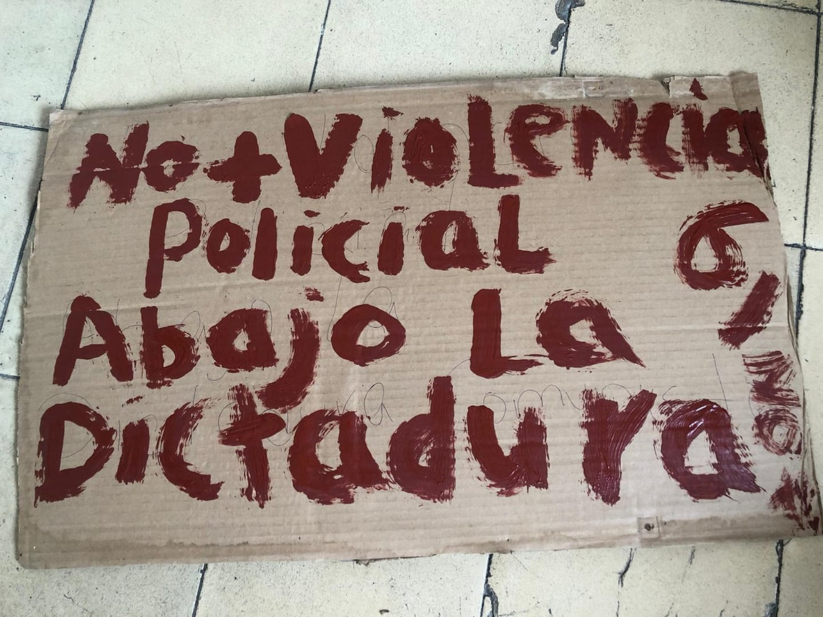 A protest sign treading, “No Police Violence, Down with Dictatorship, 6/20”