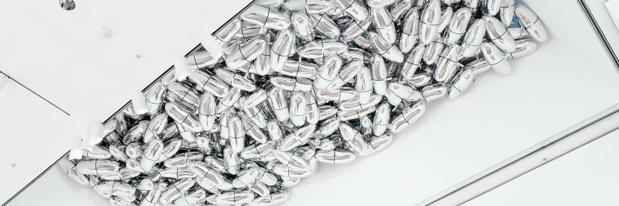 General Idea. Magi© Bullet. 1992. Installation of custom-shaped Mylar balloons, dimensions variable. Gift of Mark Krayenhoff. © 2020 General Idea. Photo: John Wronn