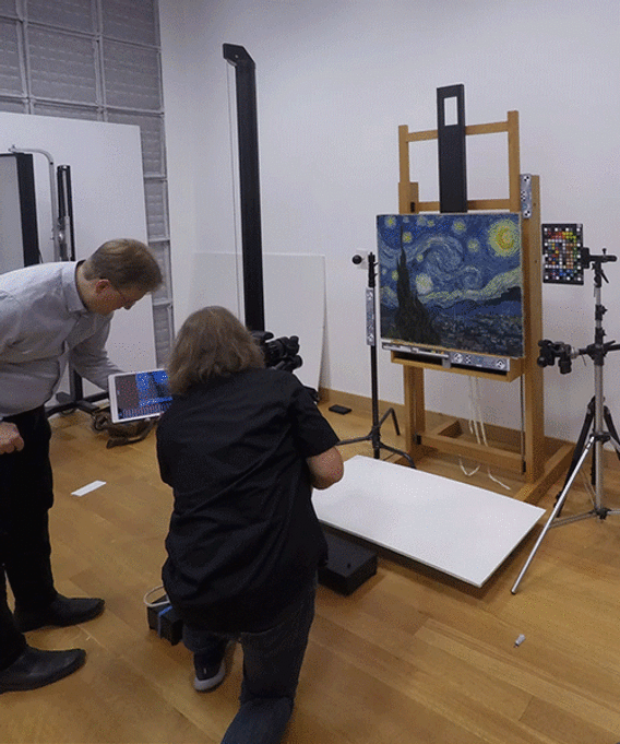 Animation showing photographer Jonathan Muzikar capturing a few of the 437 images needed to create the 3D model. You can see the painting surrounded by color and measurement targets.