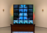 Theo Eshetu. Till Death Do Us Part. 1982–87. Two-channel video (color, sound; duration variable), 20 monitors, two clay masks, disco lights, and pew. Courtesy the artist. © 2020 Theo Eshetu. Digital image © 2020 The Museum of Modern Art, New York. Photo: Stuart Comer