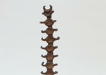 Isamu Noguchi. Small Centipede. c. 1952. Unglazed Karatsu red stoneware and wood, 15 3/4 x 4 3/4 x 4 3/4" (40 x 12.1 x 12.1 cm) including wood base. Gift of Mr. and Mrs. George Heard Hamilton in honor of Richard E. Oldenburg. © 2017 Estate of Isamu Noguchi / Artists Rights Society (ARS), New York. Photo: Paige Knight